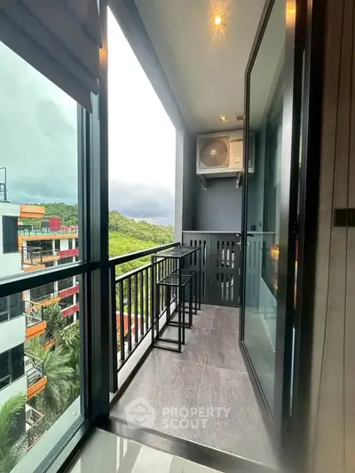 Modern balcony with scenic view and sleek railing in urban apartment