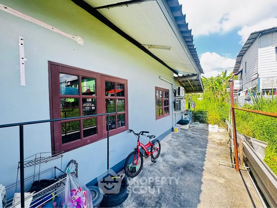 Charming residential exterior with spacious outdoor area and vibrant surroundings.