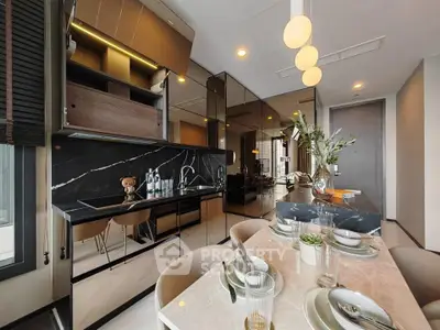 Luxurious modern kitchen with elegant dining area and sleek black marble countertops.