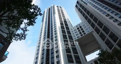 Stunning high-rise building with modern architecture and skyward view.