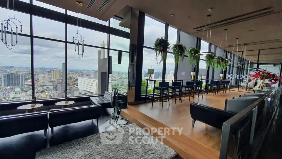 Luxurious high-rise lounge with panoramic city views and modern decor.