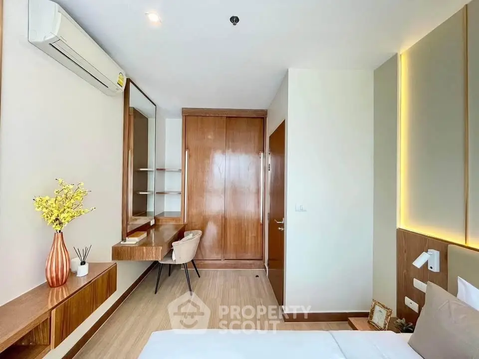 Modern bedroom with wooden accents and built-in desk