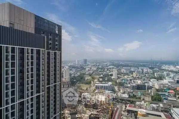 Stunning cityscape view from high-rise building showcasing urban skyline and modern architecture.