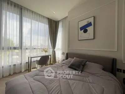 Modern bedroom with large windows and stylish decor in a luxury apartment