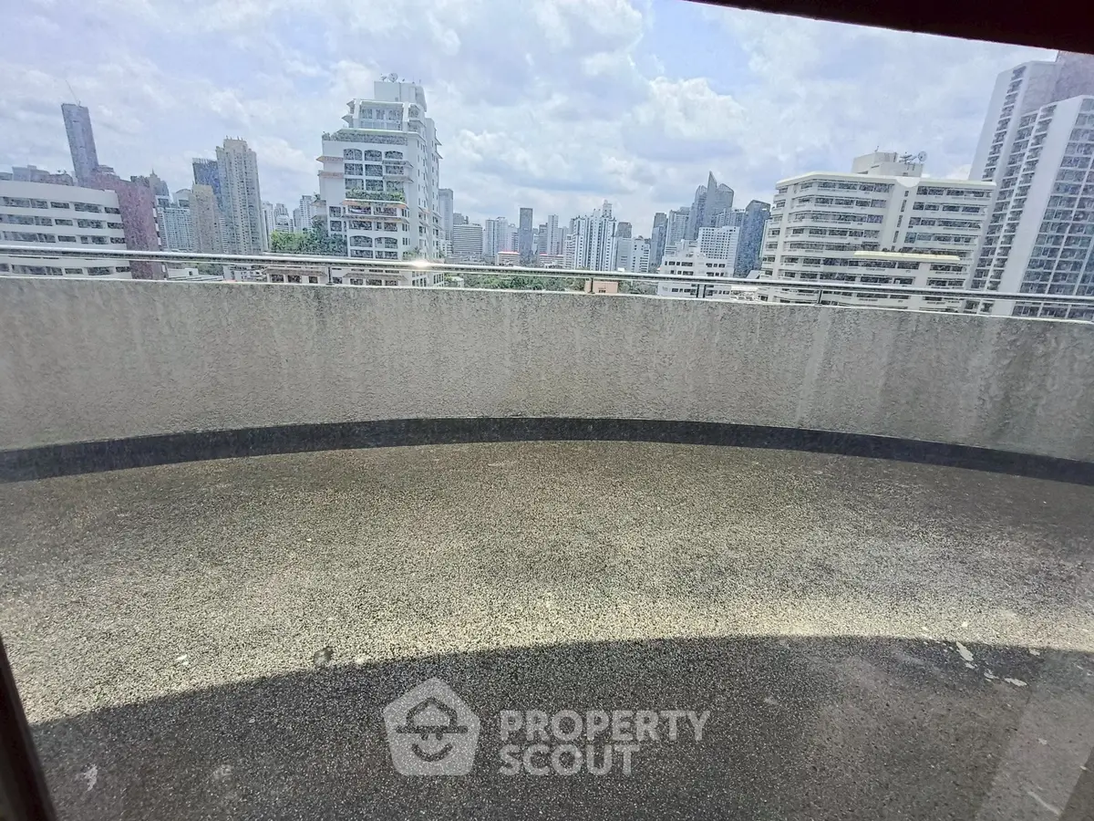 Spacious balcony with panoramic city skyline view