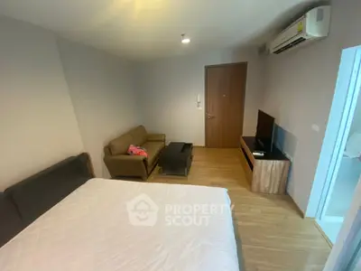 Cozy bedroom with modern furniture and air conditioning in a stylish apartment.