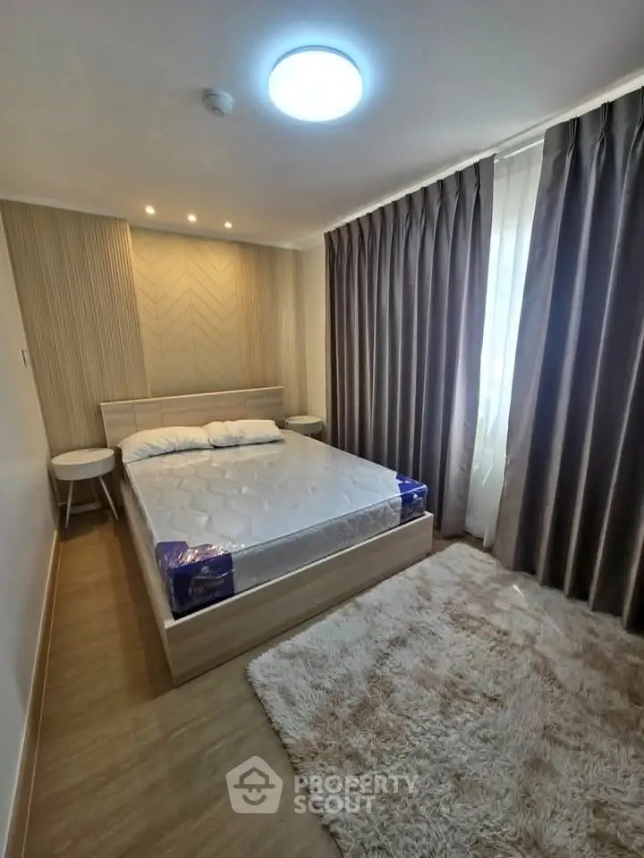Cozy modern bedroom with stylish decor and natural light