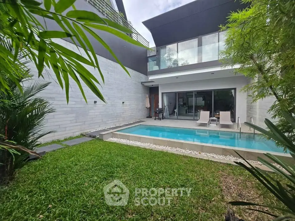 Luxurious modern villa with private pool and lush garden, perfect for relaxation and entertaining.