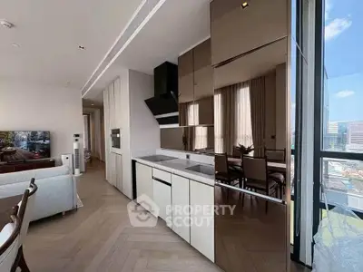 Modern open-layout kitchen and living room with city view