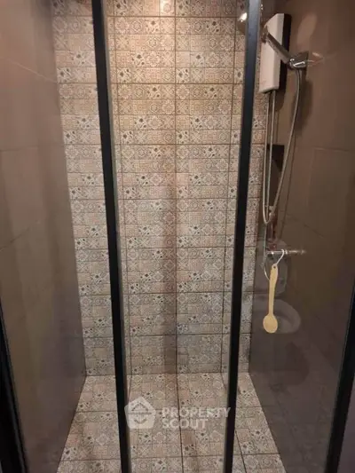 Modern bathroom with stylish tiled shower and glass doors, perfect for a contemporary home.