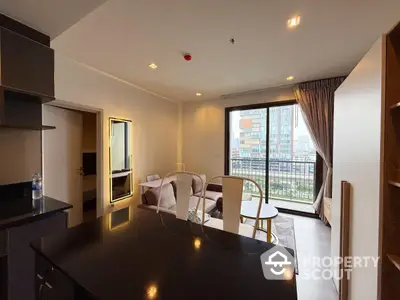 Modern living room with city view and open layout in high-rise apartment