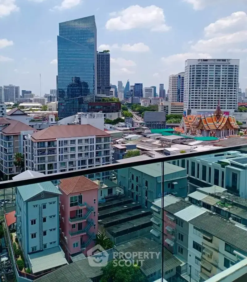 Stunning cityscape view from a modern balcony overlooking urban skyline and vibrant architecture.