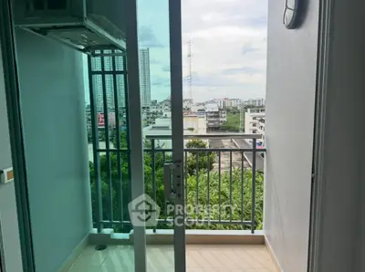 Charming balcony with city view, perfect for relaxing and enjoying urban scenery.