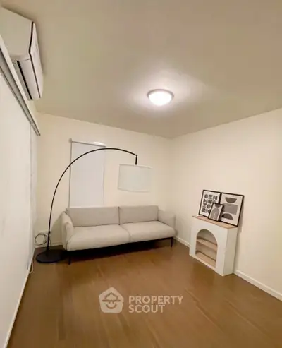 Cozy minimalist living room with modern sofa and stylish decor