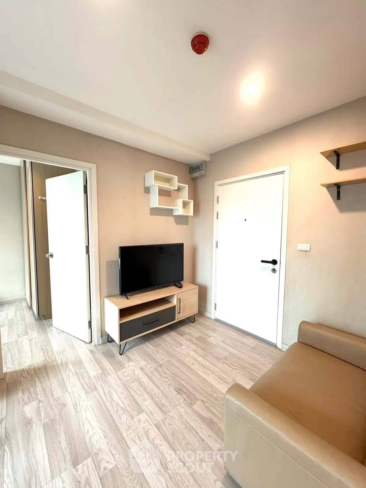 Modern living room with stylish decor and wooden flooring