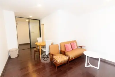 Spacious living room with modern furniture and hardwood floors