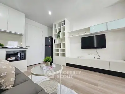 Modern living room with sleek furniture and built-in storage, perfect for urban living.