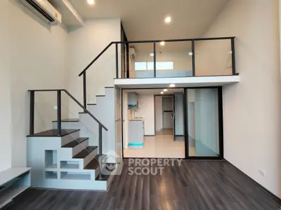 Modern loft apartment with mezzanine and sleek interior design