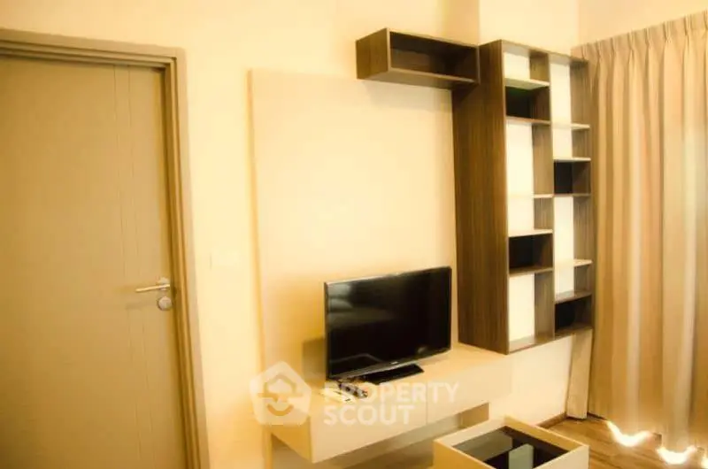 Modern living room with sleek TV unit and stylish shelving