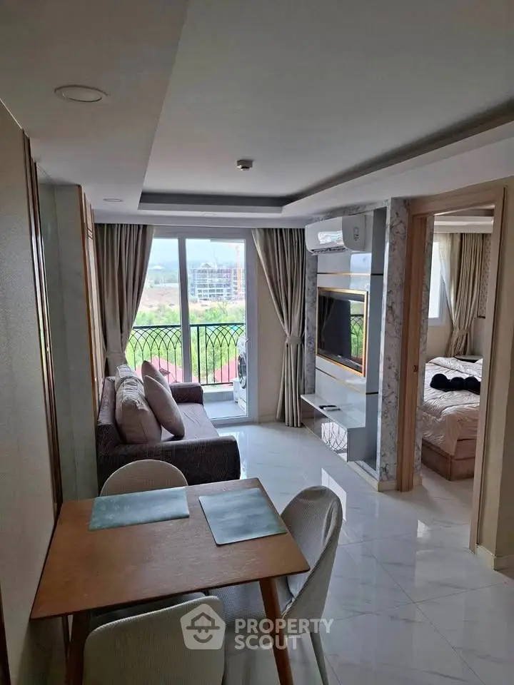 Modern apartment with open living room and balcony view