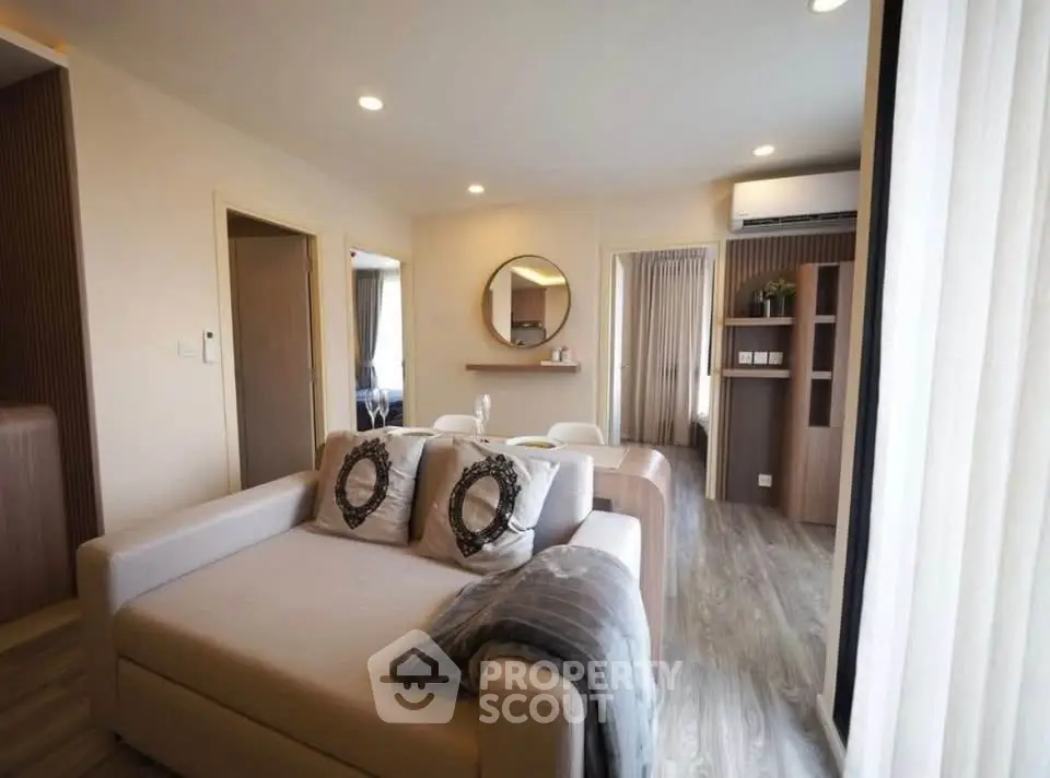 Modern living room with stylish decor and open layout in a cozy apartment.