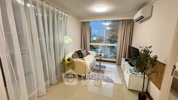 Chic living room with city view, modern decor, and cozy ambiance