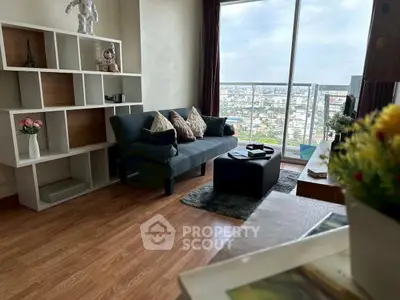 Stylish living room with city view, modern decor, and cozy seating area.