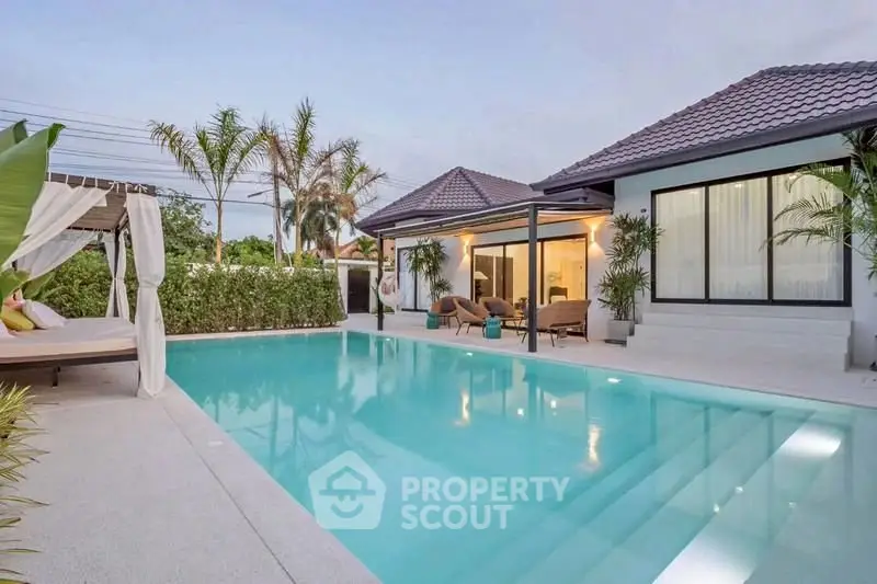 Luxurious villa with private pool and lush garden, perfect for relaxation and entertaining.