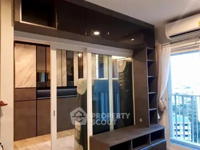 Modern bedroom with built-in storage and balcony view