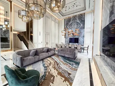 Luxurious modern living room with high ceilings and elegant decor