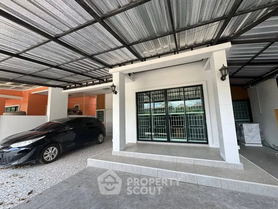 Spacious covered parking area with modern design and secure entrance