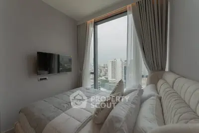 Luxurious bedroom with city view and modern decor