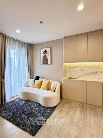 Modern living room with cozy sofa and stylish decor in a bright apartment.