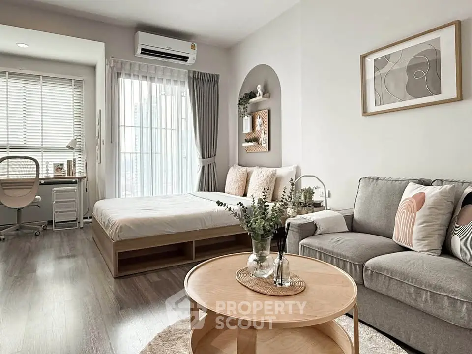 Modern studio apartment with cozy living area and stylish decor