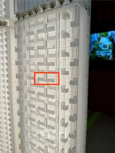 Modern high-rise building architectural model showcasing innovative design