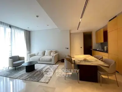Modern open-plan living room with elegant dining area and natural light