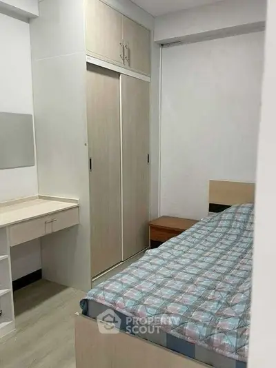 Cozy bedroom with built-in wardrobe and modern decor