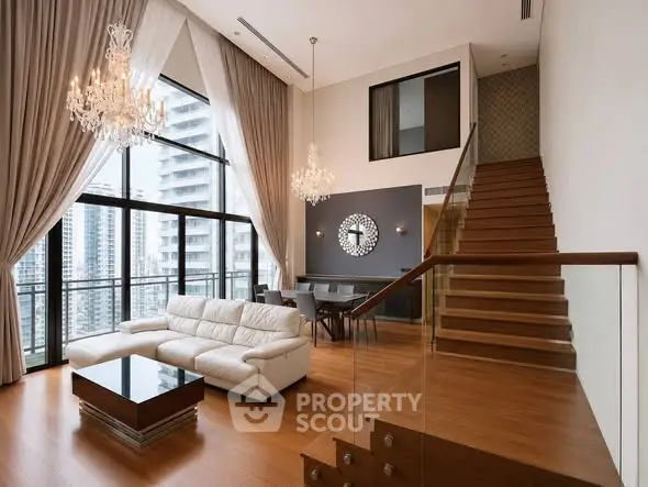 Luxurious modern living room with high ceilings, elegant chandeliers, and stunning city view from large windows.