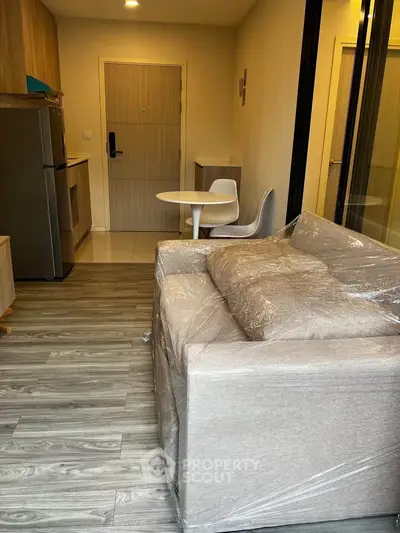 Modern apartment interior with compact kitchen and cozy living area