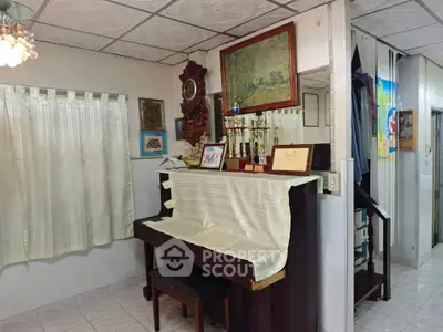 Charming interior with piano and awards, showcasing a cozy and personalized living space.