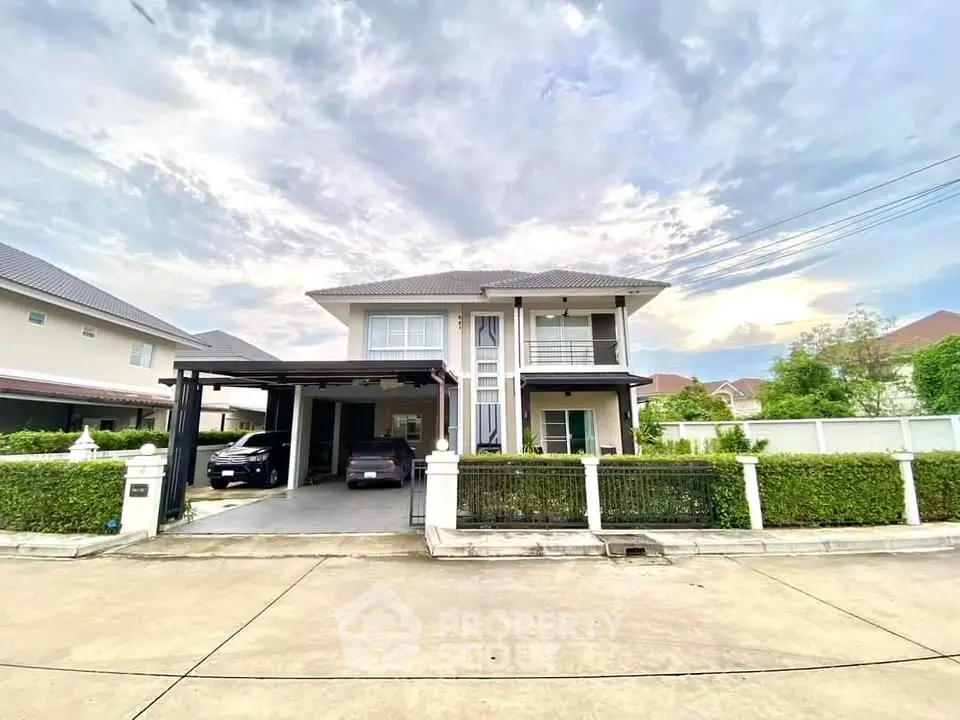 Stunning two-story house with modern design and spacious driveway in a serene neighborhood.