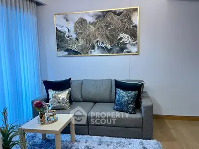 Stylish living room with modern sofa and elegant wall art