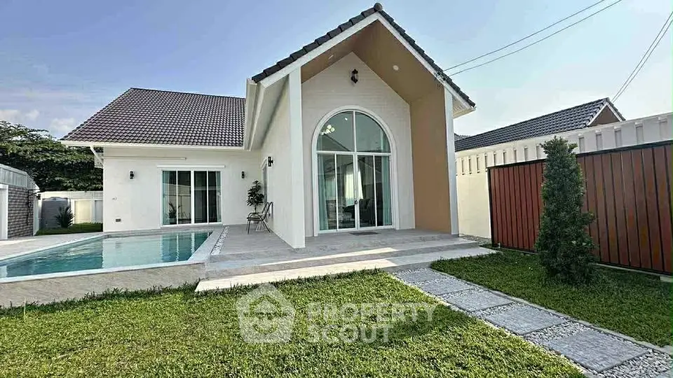 Charming modern house with pool and lush garden, perfect for family living.