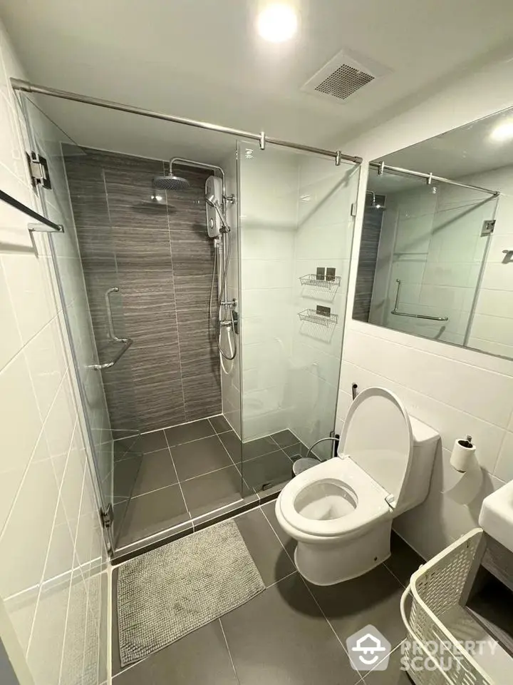 Modern bathroom with glass shower enclosure and sleek design