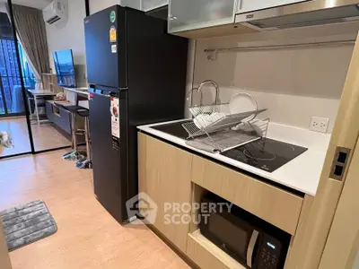 Modern kitchen with sleek appliances and open layout in stylish apartment