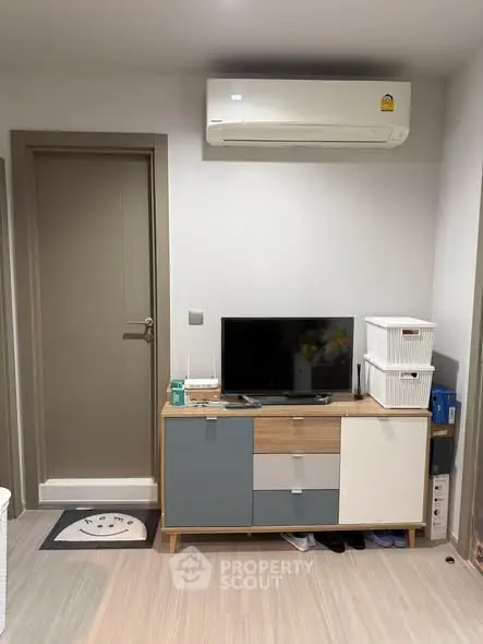 Modern living room with air conditioning and stylish storage unit