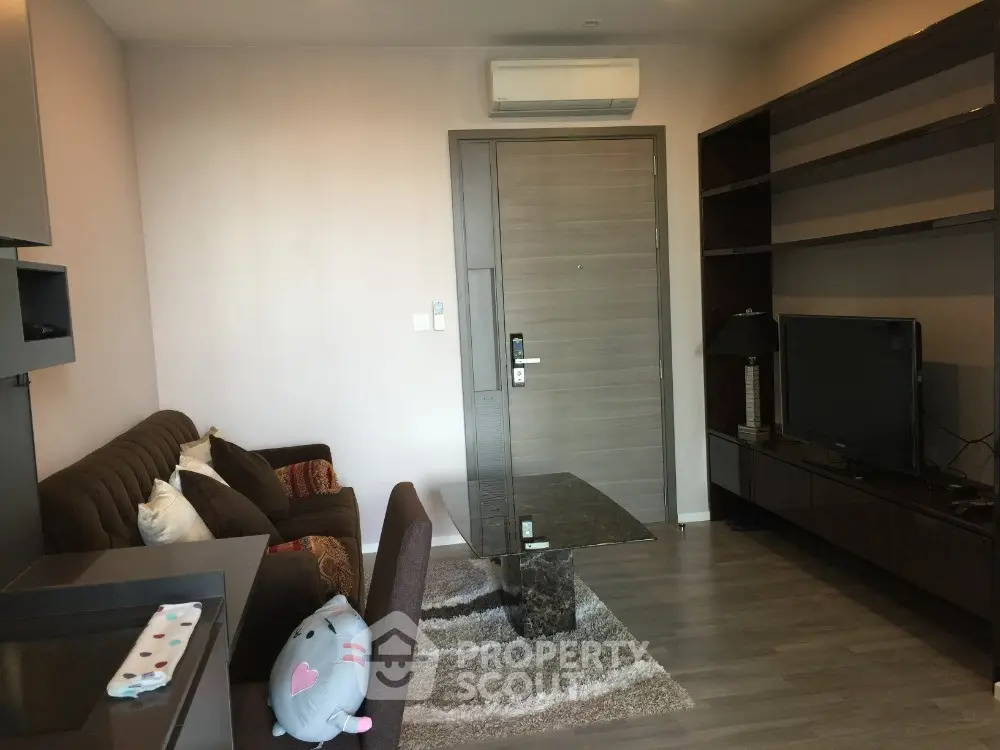 Modern living room with sleek furniture and air conditioning in a stylish apartment.