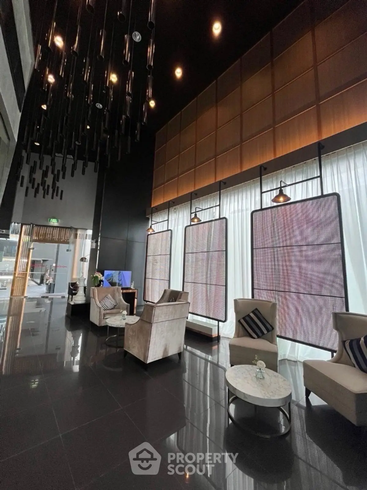 Luxurious modern lobby with high ceilings and elegant seating area