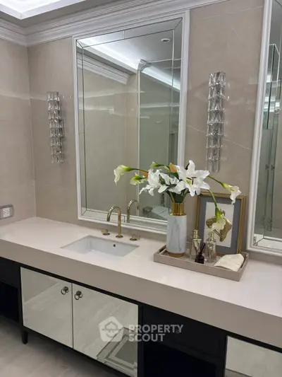 Luxurious bathroom with elegant vanity and floral decor