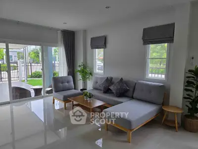 Modern living room with stylish furniture and garden view